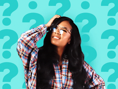 Woman looking off into the distance with question marks surrounding her